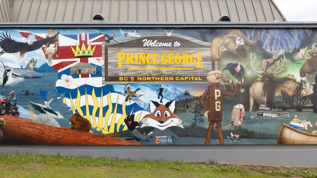 A colourful "Welcome to Prince George" sign painted on the side of a building.