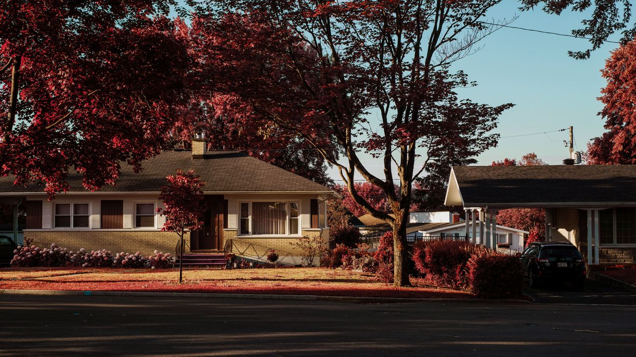 a house with a car parked in front of it
