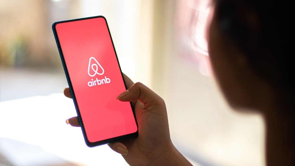 A phone with the Airbnb app open.