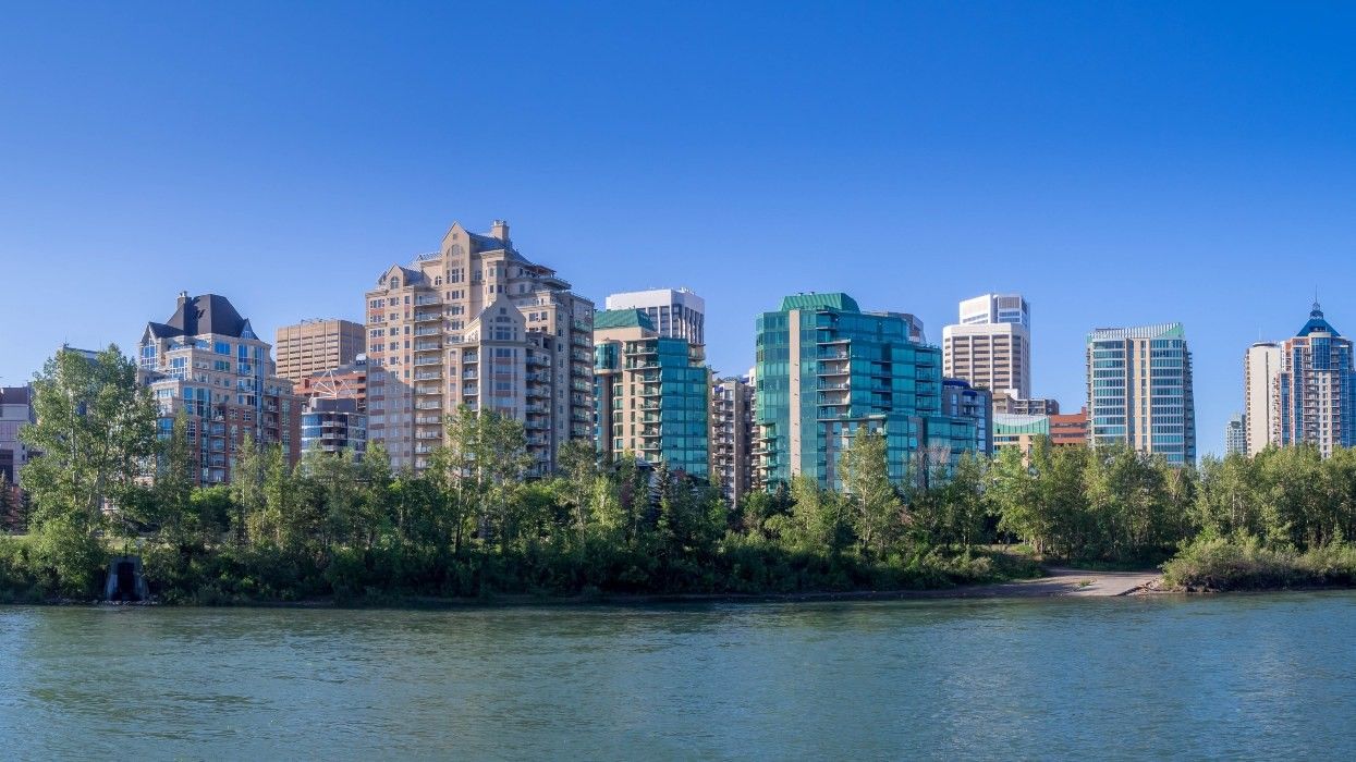 A row of apartment buildings along the water in Calgary.