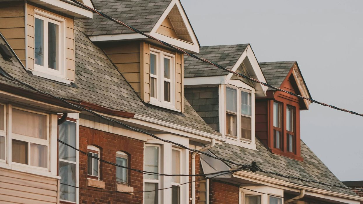 a row of houses on a cloudy day
