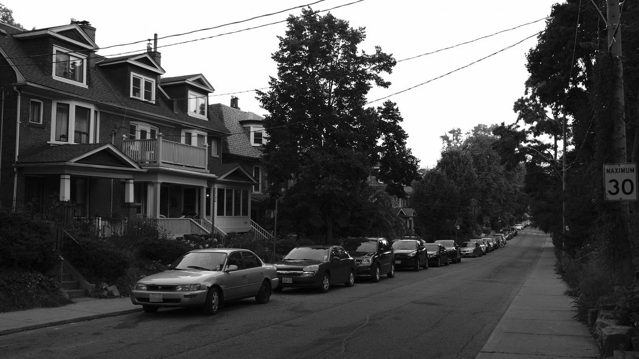 a Toronto street with cars parked along it