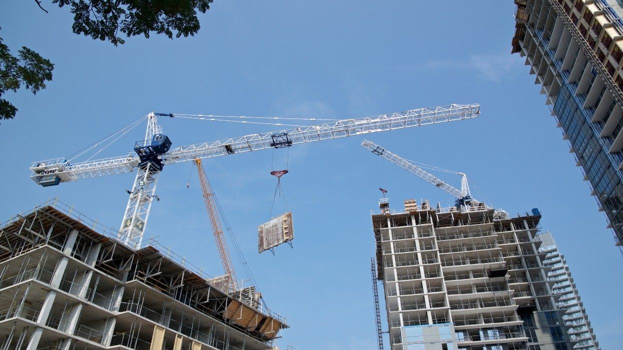 A trio of buildings under construction.