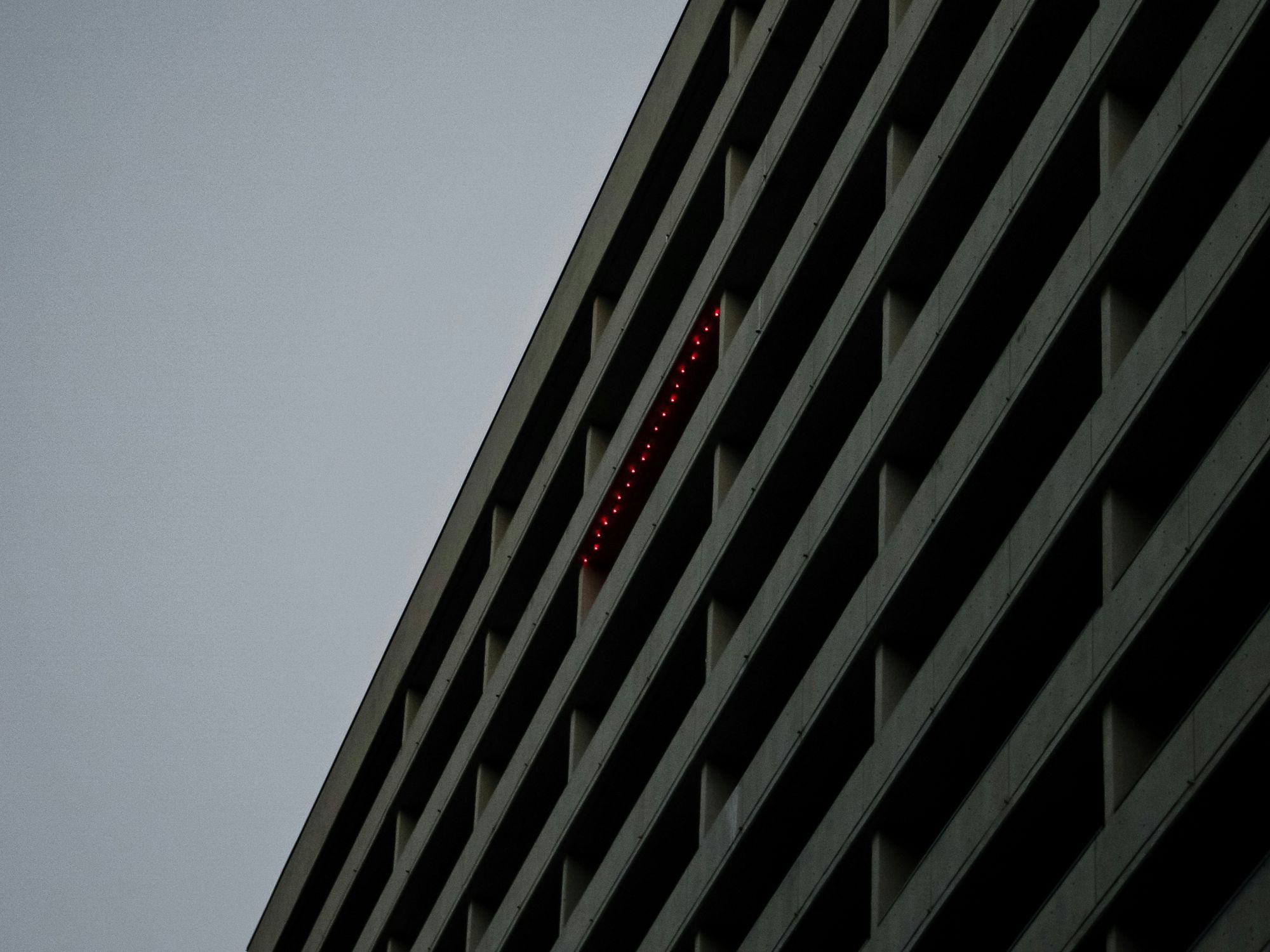 a white and black concrete building.