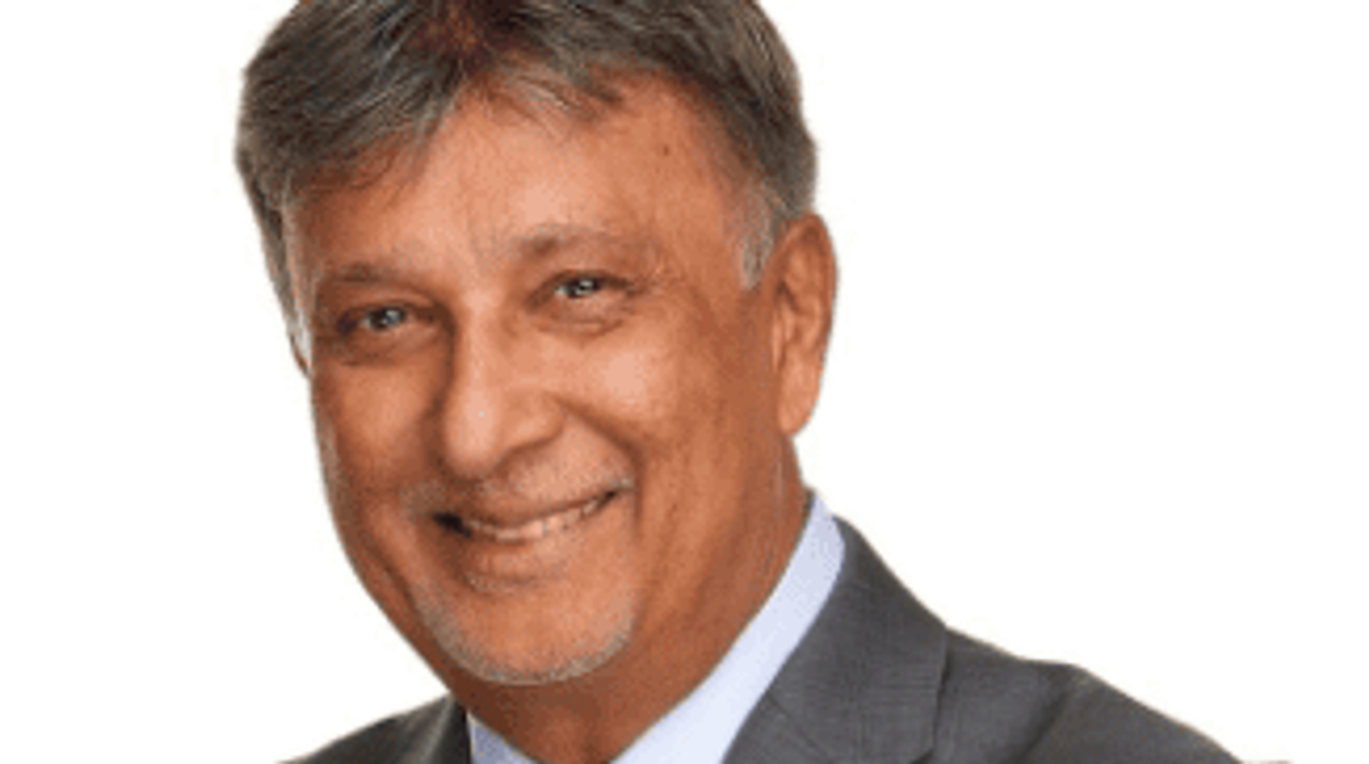 Al Moosa from Century 21 cares for his clients as though they were family. For him it's less about numbers and more about the people. One of the most dedicated in the field, Moosa has been named one of Century 21's Centurion Producers. (Photo by One Tree Studio Inc.)