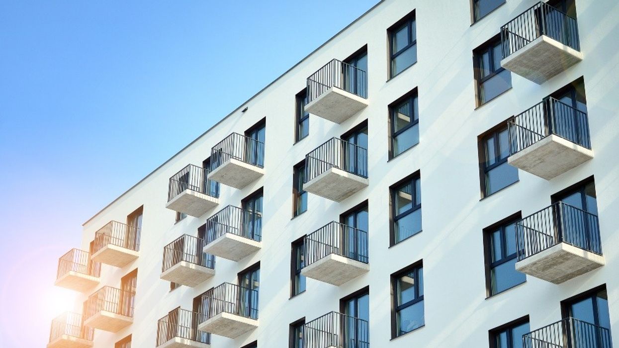 An apartment building as the sun sets.