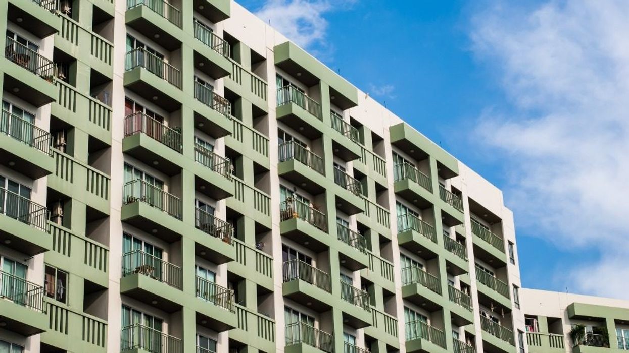An apartment building in an unknown location.