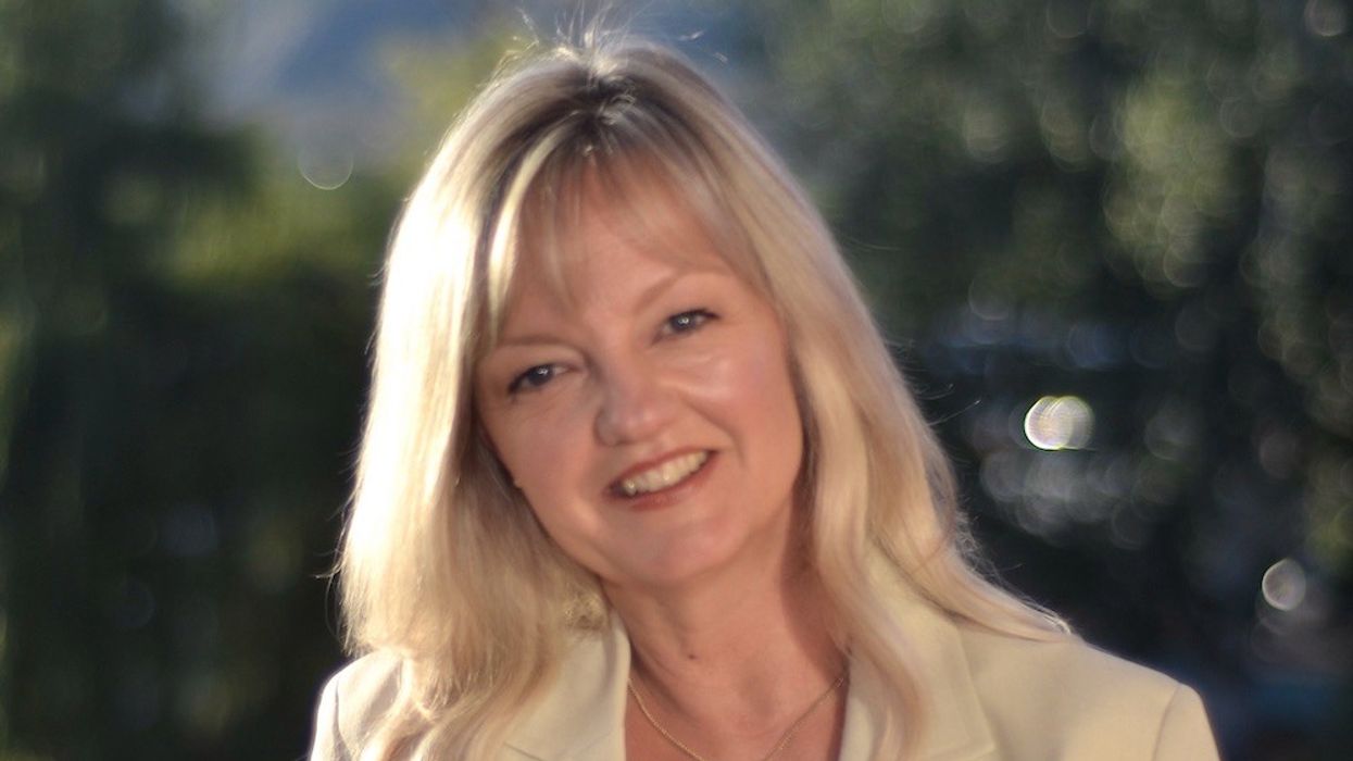 Audrey Zimmermann smiling ahead of natural backdrop