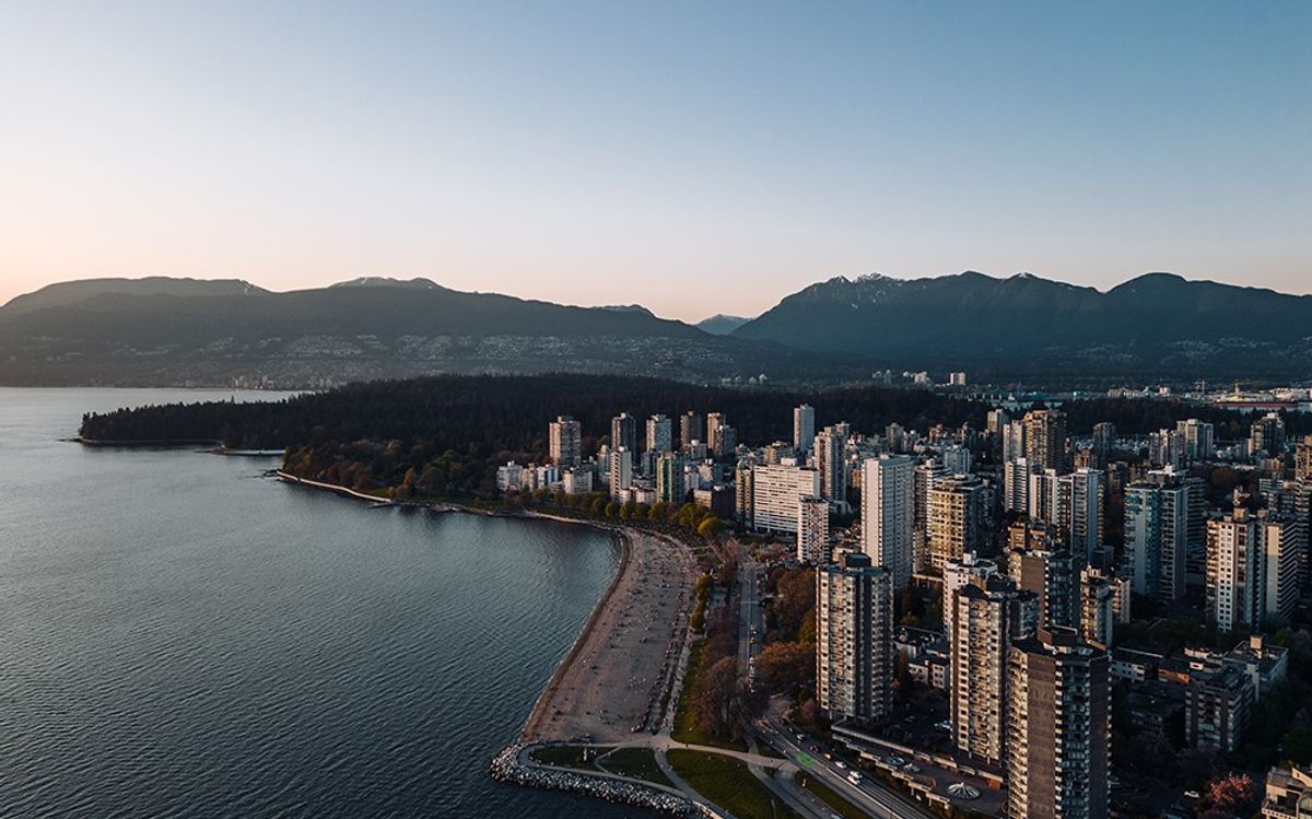 Birds-eye view of Vancouver waterfront with mountains in the background