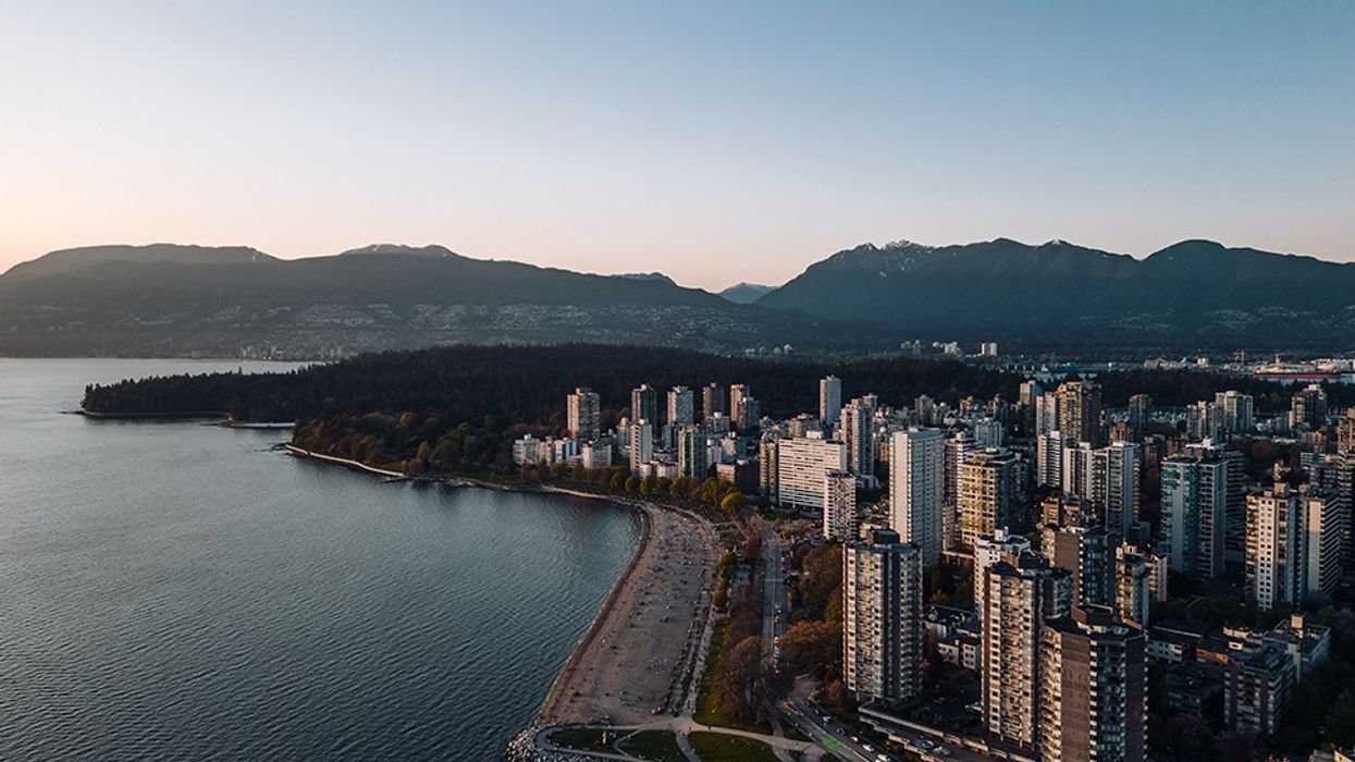 Birds-eye view of Vancouver waterfront with mountains in the background