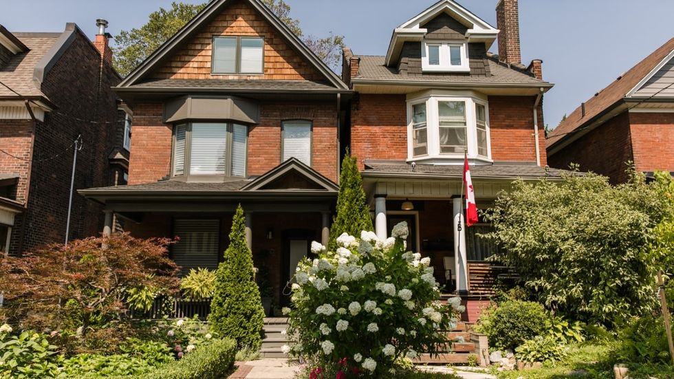Brick homes on a residential street in Toronto.
