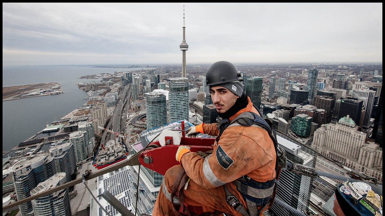 Crane Rigger, Marco Ottorino, sits at the apex of Harbour Plaza’s East Tower Crane as it is taken down in February. The photography for this project took place at the Harbour Plaza and the One York Street site over the past four years.