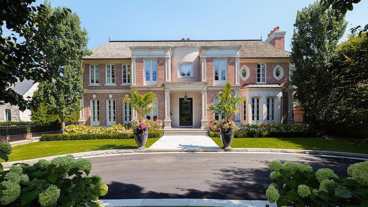 Georgian style estate framed by manicured gardens
