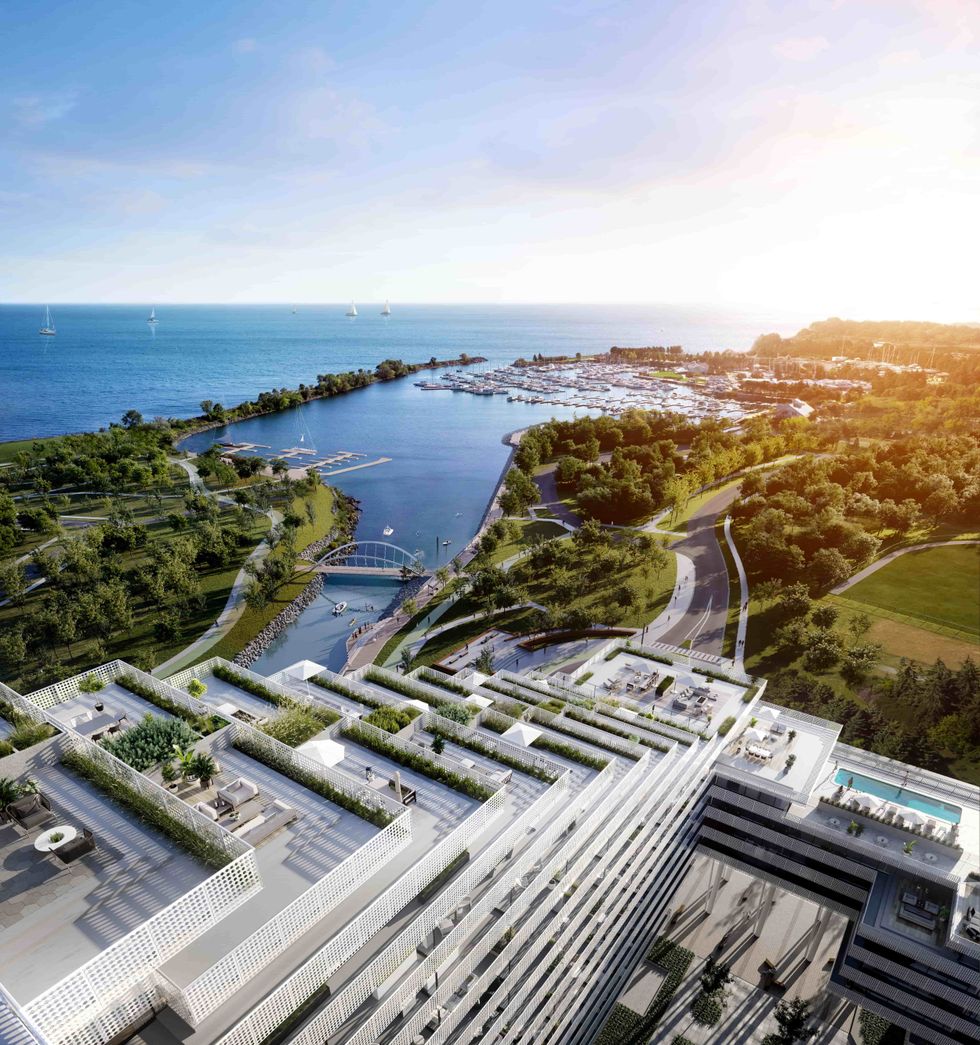 Harbourwalk's cascading patios from above, overlooking Lake Ontario and lush treelines