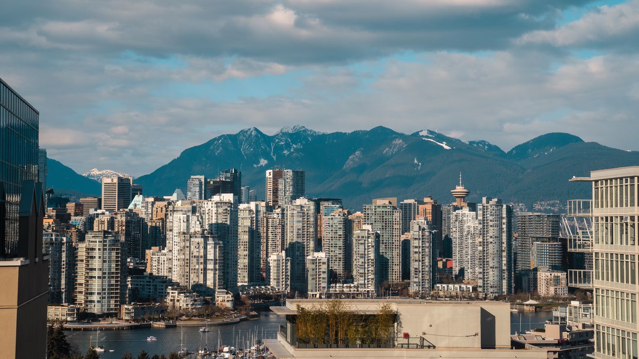 high rise buildings with view of mountain during daytime