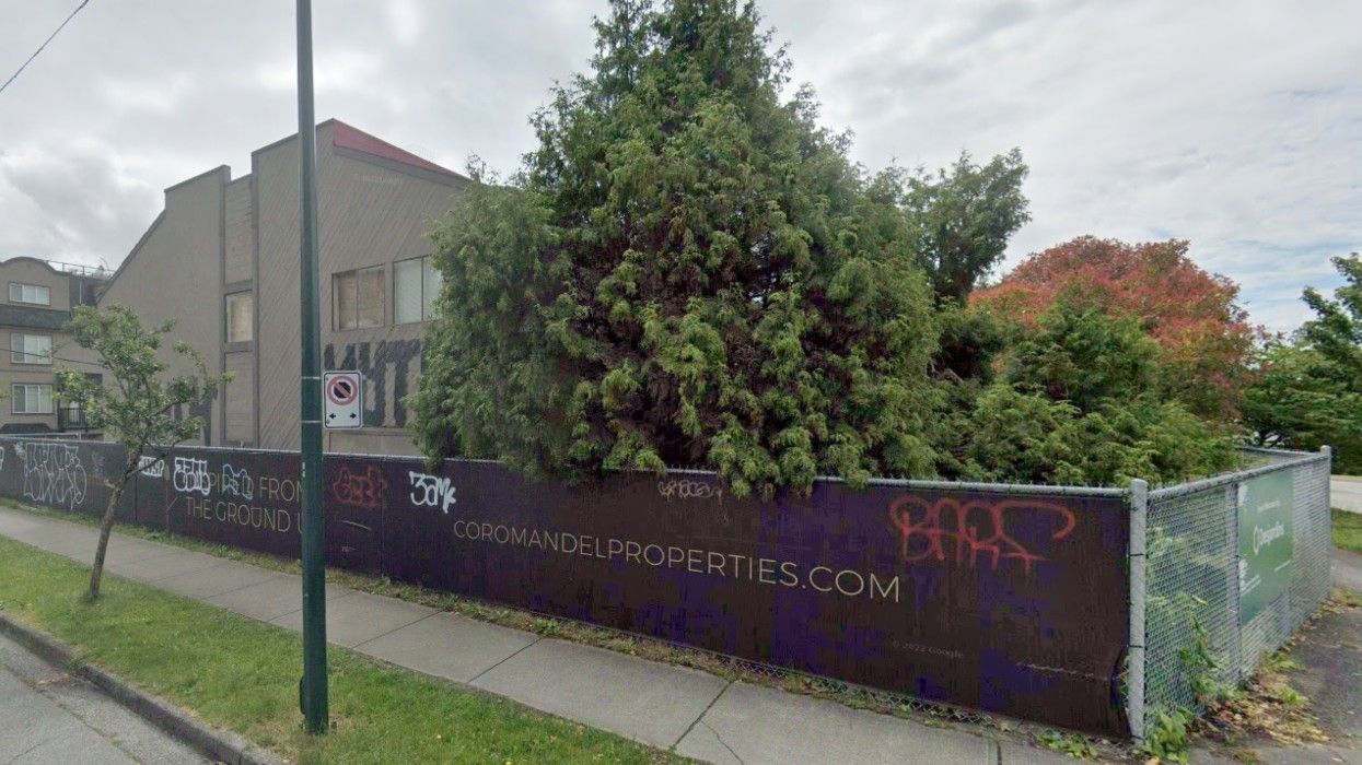 The 7510 Cambie Street property in Vancouver, fenced off with Coromandel Properties banners.