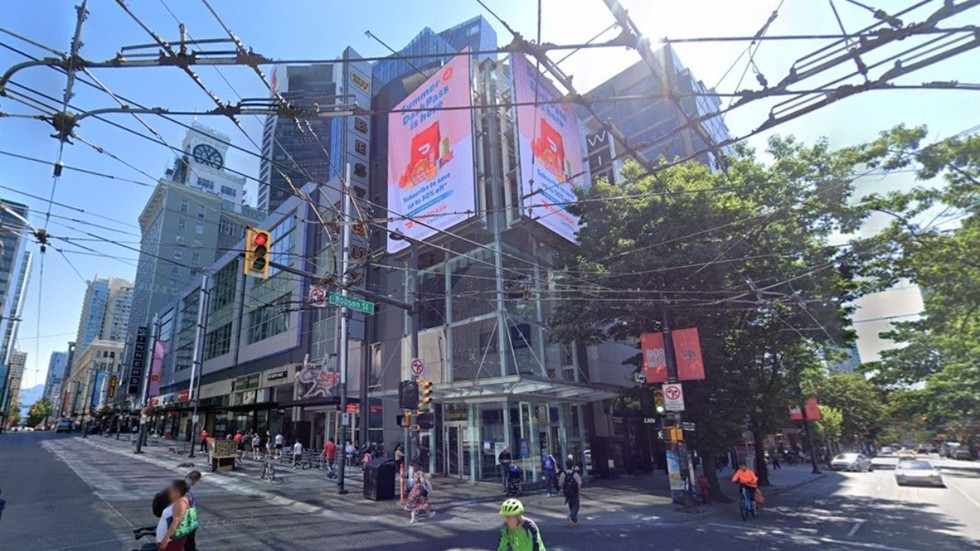 The large retail complex at the corner of Granville Street and Robson Street in July 2024.