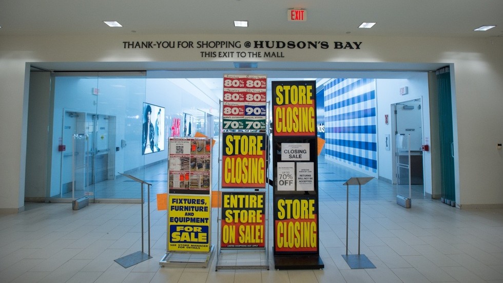 The main exit of a Hudson's Bay store amidst liquidation sales.