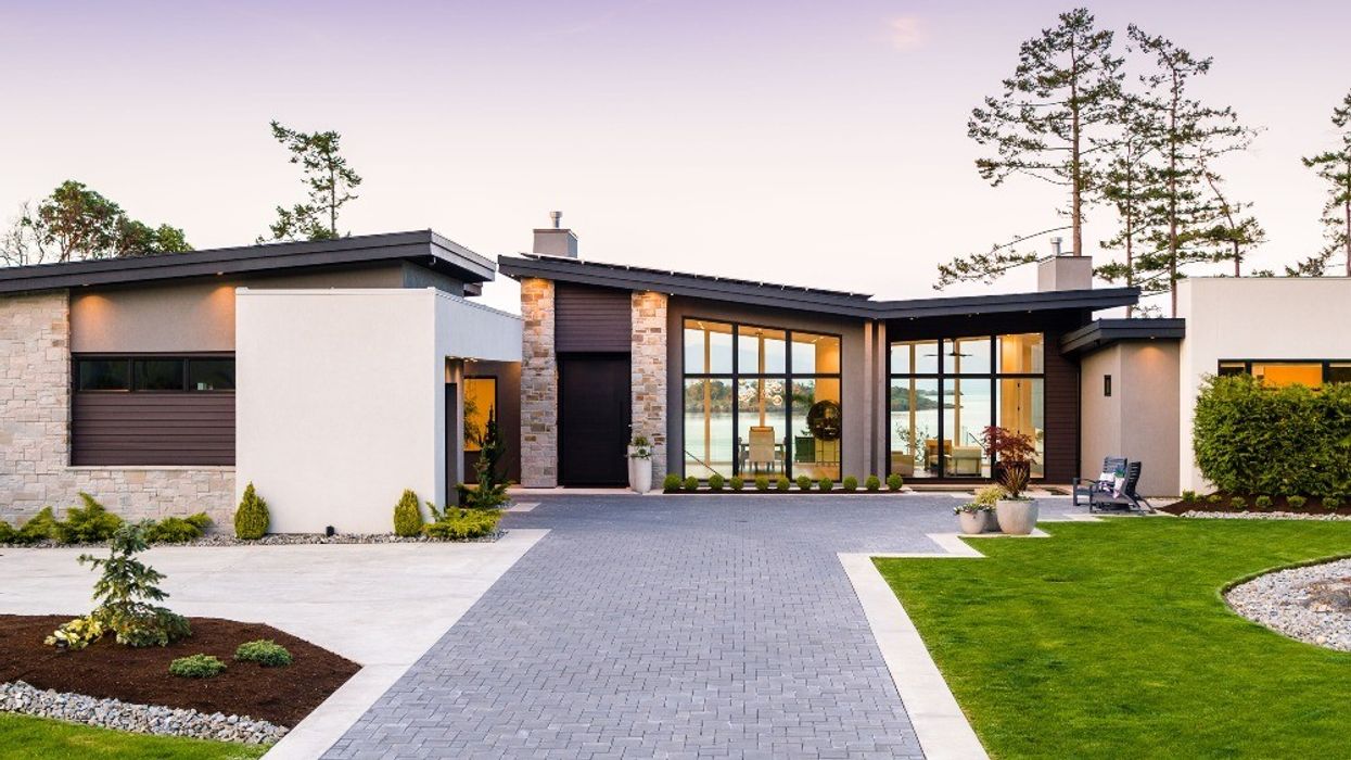 The stone driveway that leads to the modern home on 1730 Oak Leaf Drive.
