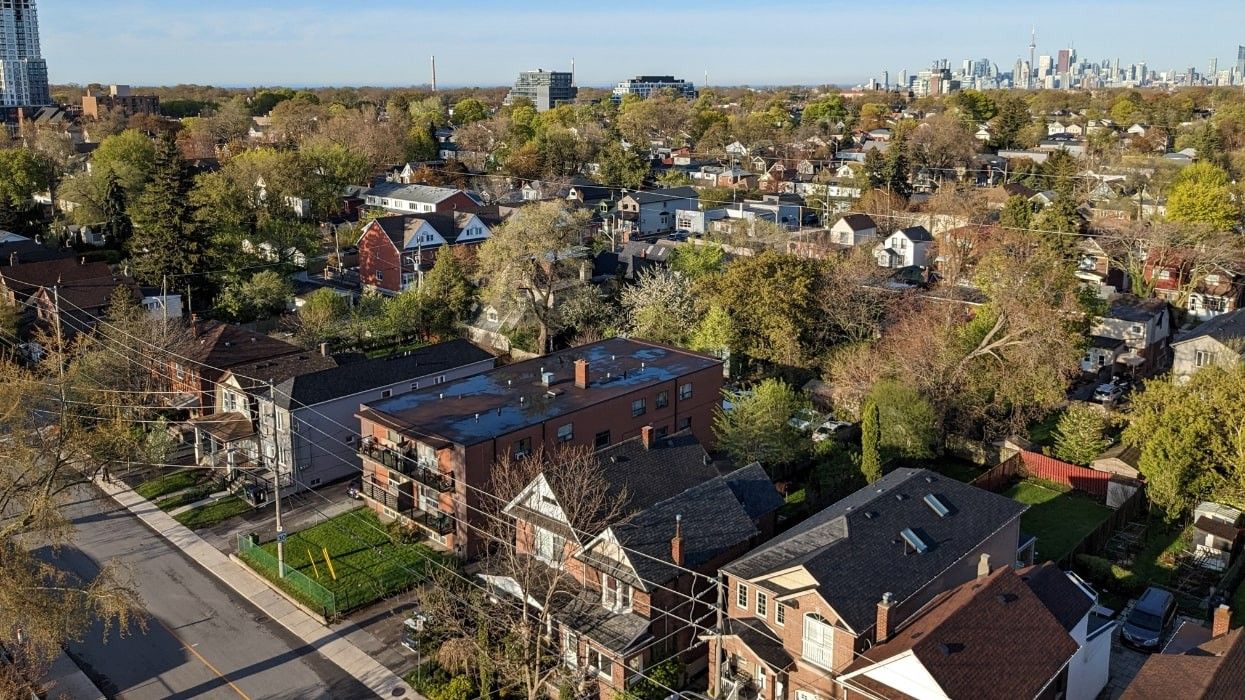 Toronto houses with the city's downtown core in the background.