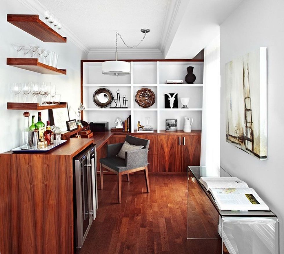 What to do with all of that extra space  LUX Design built a multifunctional den, fitting many features into a small area, including a built-in bar. The cabinetry wood grain matches the flooring to create a seamless connection to the room as a whole. (Photo by Lisa Petrole)