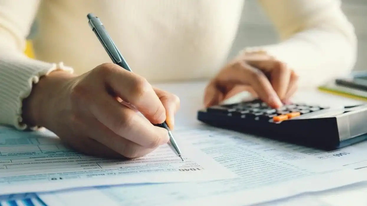Woman filing her income tax return, tax incentives.